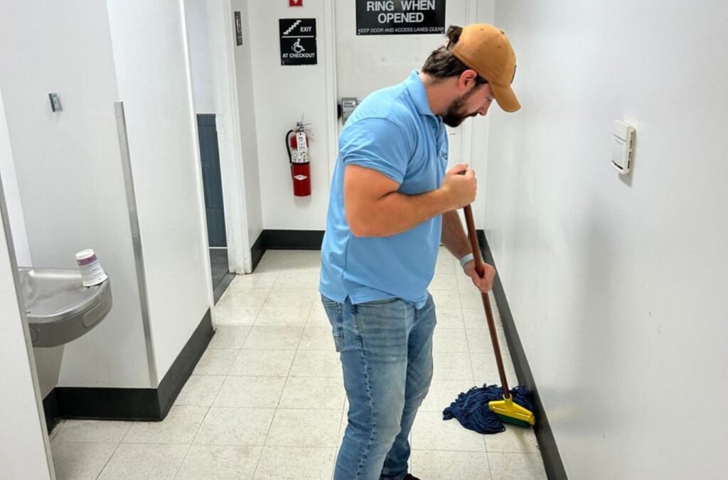 An MM Commercial Cleaning team member working in Orchard Park, NY, showcasing the value of using a dependable local cleaning company for commercial spaces.