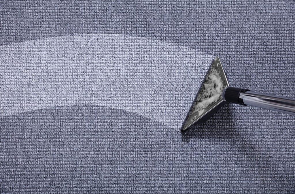 An MM Commercial Cleaning team member cleaning carpets in Buffalo, NY, showing the advantages of local expert care for healthier, cleaner interiors.